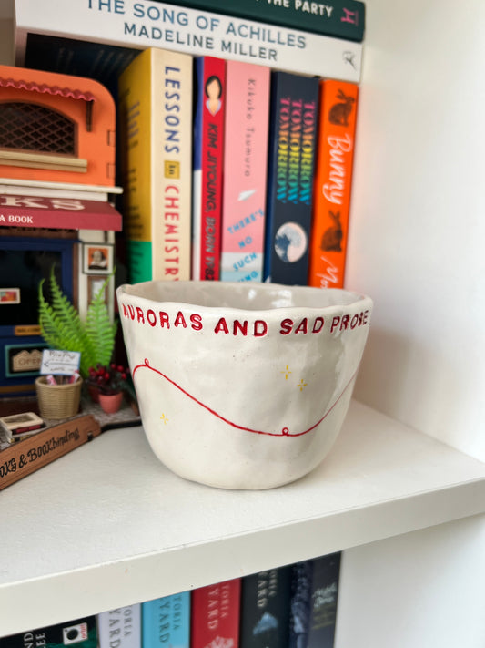 Auroras and sad prose cup