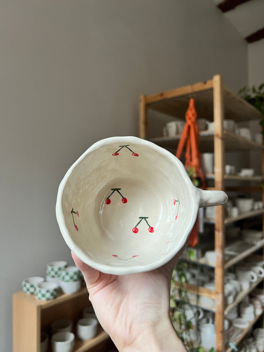 Inverted cherry mug